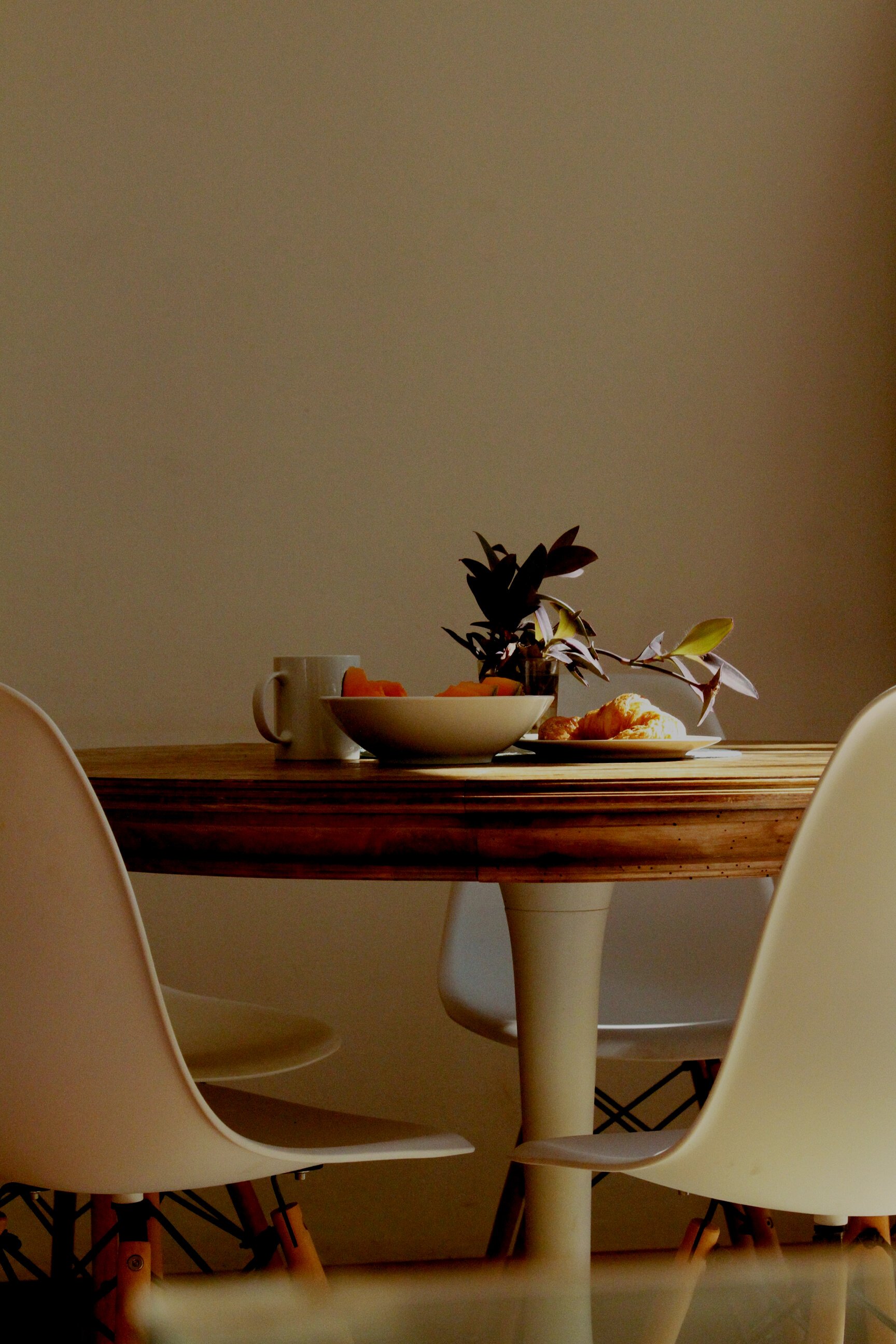 Croissant Bread Beside Bowl and Mug on Table