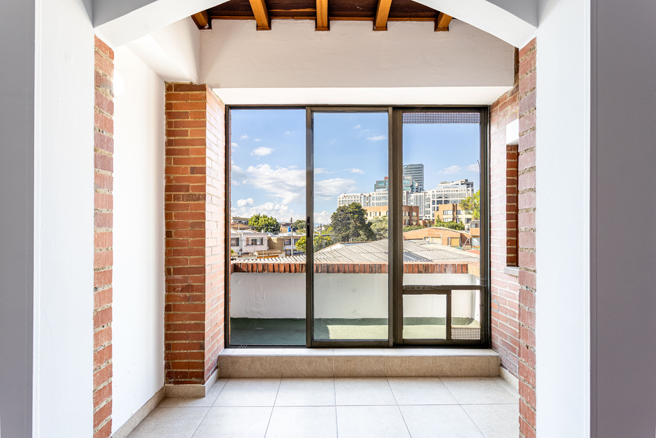 Glass Door Near the Brick Wall